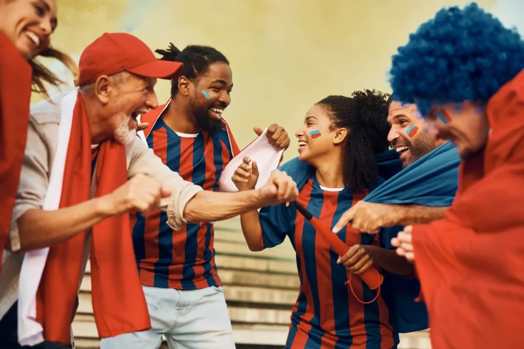 Fans freuen sich vor einem Spiel und singen